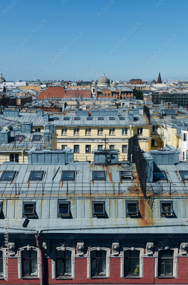 RUSSIA, Saint Petersburg: Scenic aerial cityscape view of the sunny city roofs and architecture with blue clear sky