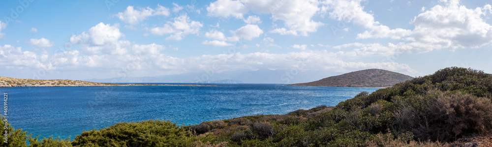 panoramic view with clouds from the bay near the sunken city of Olus, on the island of Crete on a sunny day, windy day,