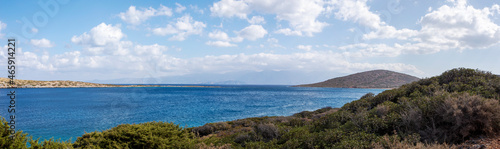 panoramic view with clouds from the bay near the sunken city of Olus, on the island of Crete on a sunny day, windy day, © Nataliia Makarovska
