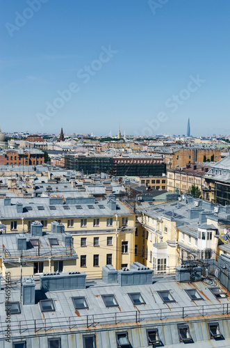 RUSSIA, Saint Petersburg: Scenic aerial cityscape view of the sunny city roofs and architecture with blue clear sky