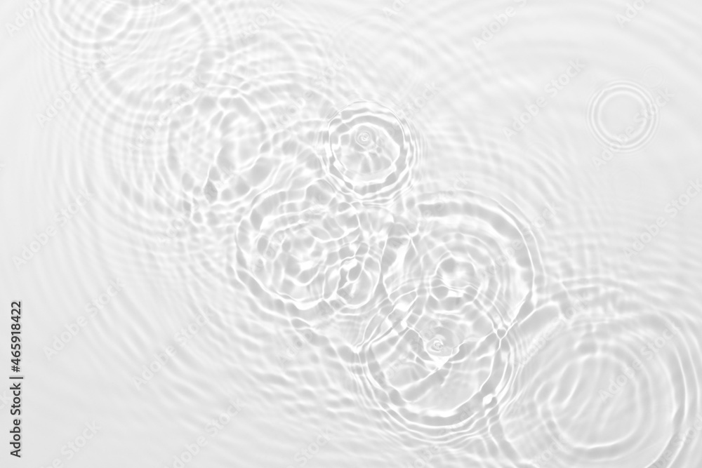 Desaturated transparent clear calm water surface texture with ripples, splashes Abstract nature background. White-grey water waves in sunlight Copy space Cosmetic moisturizer micellar toner emulsion Desaturated transparent clear calm water surface texture with ripples, splashes Abstract nature background. White-grey water waves in sunlight Copy space Cosmetic moisturizer micellar toner emulsion