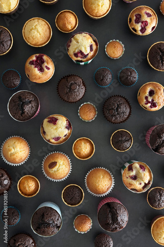 Various flavor of muffins on black background