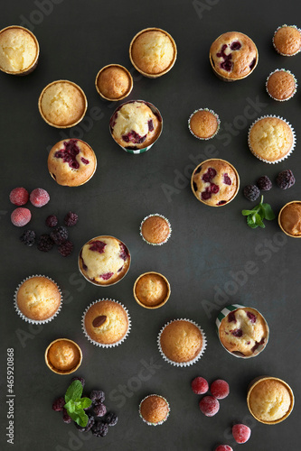 Various flavor of muffins on black background