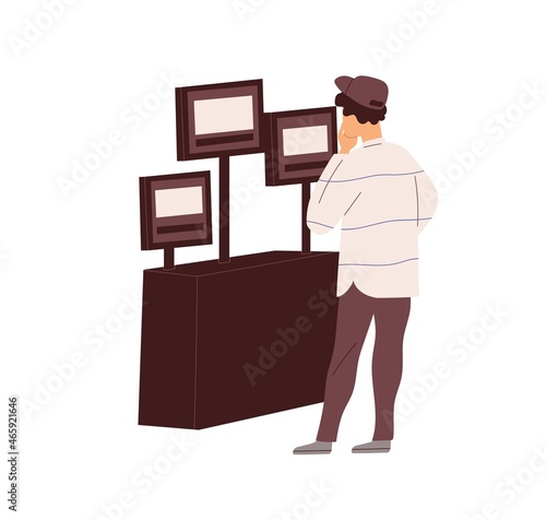 Film director looking at screens during movie production, watching video scen...