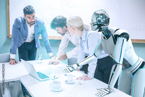Businessmen with humanoid robot working