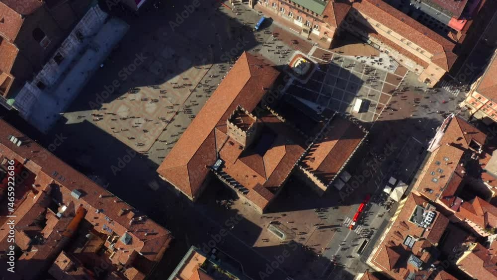Bologna, Emilia-Romagna, Italy, October 2021. Drone in Bird's-eye view slowly orbits the Palazzo Re Enzo from the east, surrounded by the Medieval city center on a sunny day. Bologna, Emilia-Romagna, Italy, October 2021. Drone in Bird's-eye view slowly orbits the Palazzo Re Enzo from the east, surrounded by the Medieval city center on a sunny day.