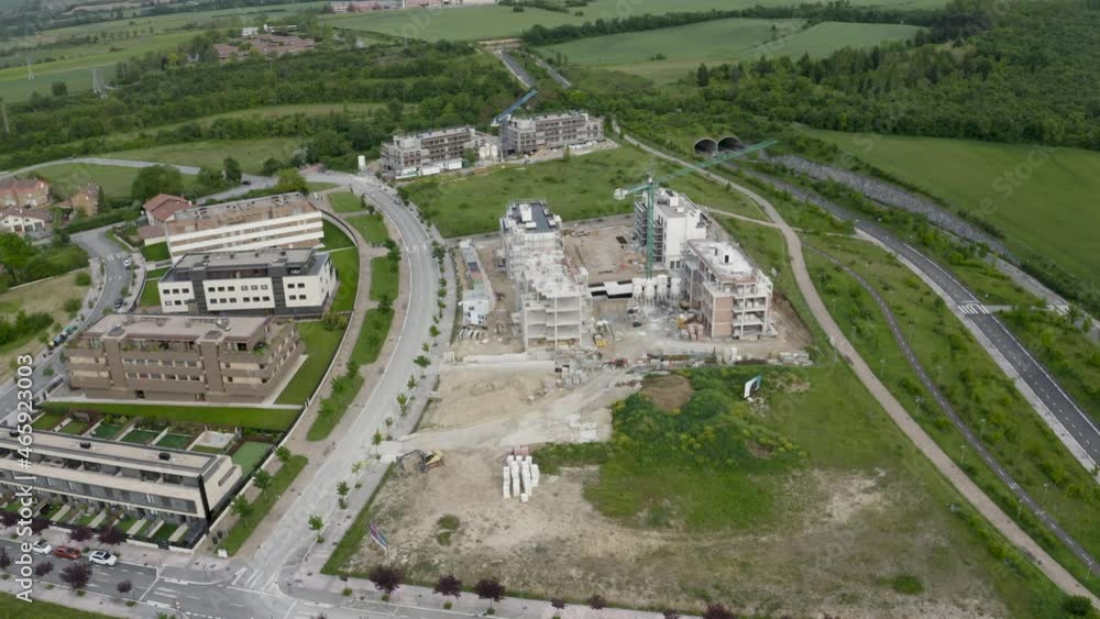 Large building site with new homes being built on the edge of a city. Large building site with new homes being built on the edge of a city.