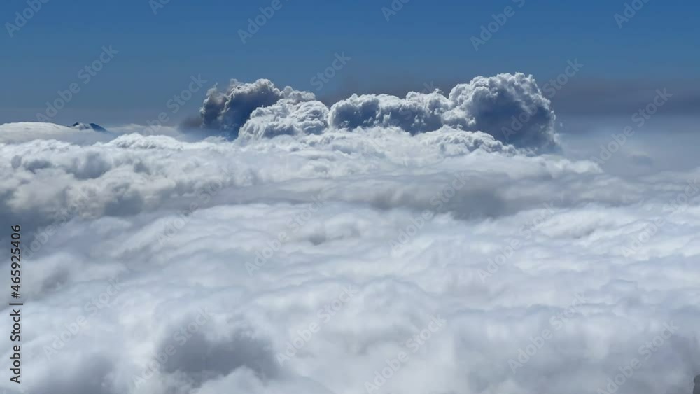 View of the erupting volcano on the island of La Palma, Spain from behind the clouds View of the erupting volcano on the island of La Palma, Spain from behind the clouds