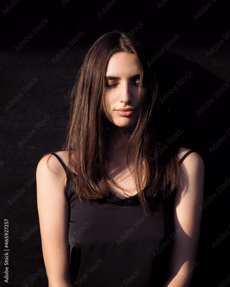 Fashion woman portrait with contrast lighting in the city Fashion woman portrait with contrast lighting in the city