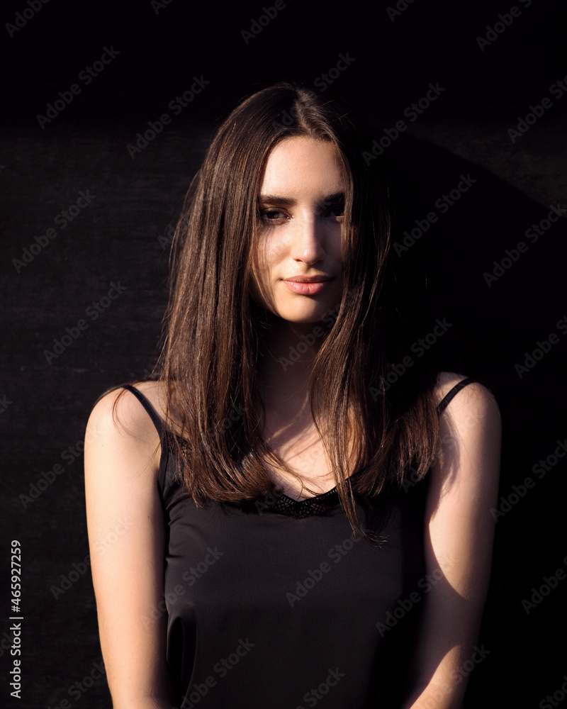Fashion woman portrait with contrast lighting in the city Fashion woman portrait with contrast lighting in the city