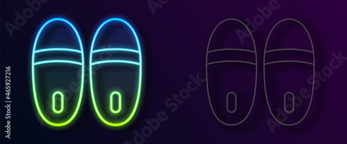 Glowing neon line Slippers icon isolated on black background. Flip flops sign. Vector