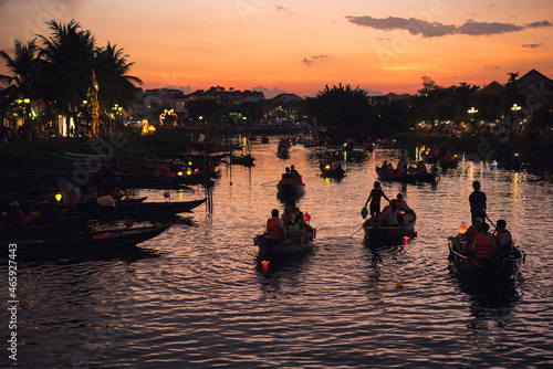 Tourists enjoying boat ride at sunset in Hoi An  Vietnam                                                                               