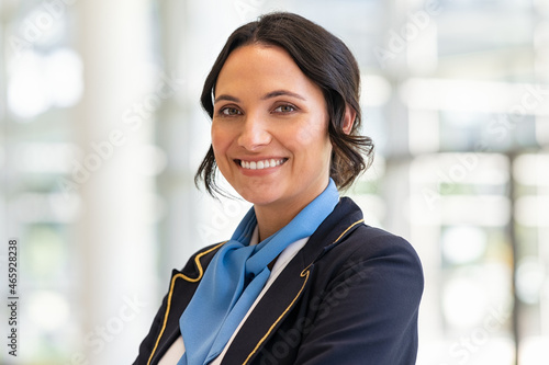 Happy smiling flight attendant at airport photo