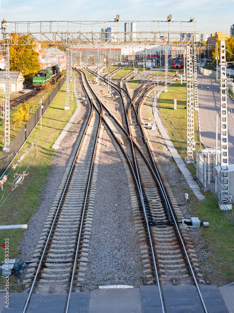 above view of railways and locomotive depot in Moscow city in sunny autumn evening
