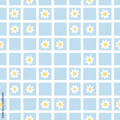 Fototapeta Naklejka Na Ścianę i Meble -  Chamomile in white lattice on blue background. Cute seamless pattern. Summer and spring texture great for fabric and paper.
