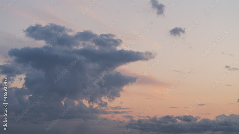 Evening clouds in the sky in summer evening with warm light Evening clouds in the sky in summer evening with warm light