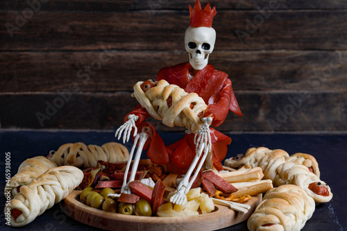 Halloween Food With Skeleton In Bresaola And Snack Plate On Wooden Background.
