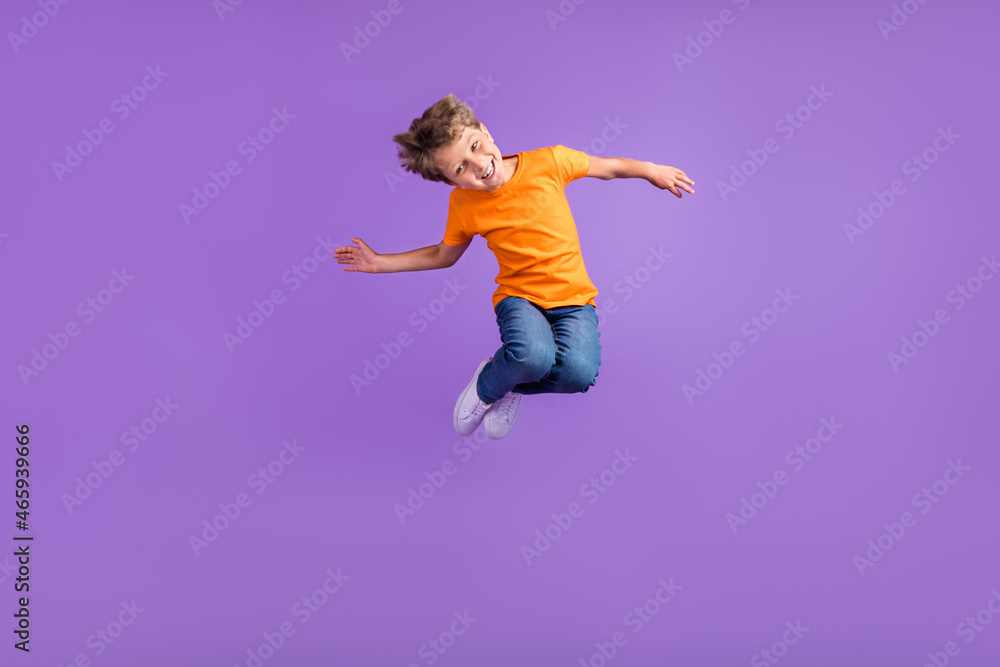 Full length body size photo boy jumping careless cheerful happy isolated pastel violet color background