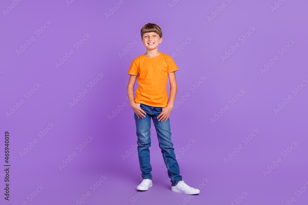Full length body size photo boy wearing stylish outfit cheerful happy isolated pastel purple color background Full length body size photo boy wearing stylish outfit cheerful happy isolated pastel purple color background