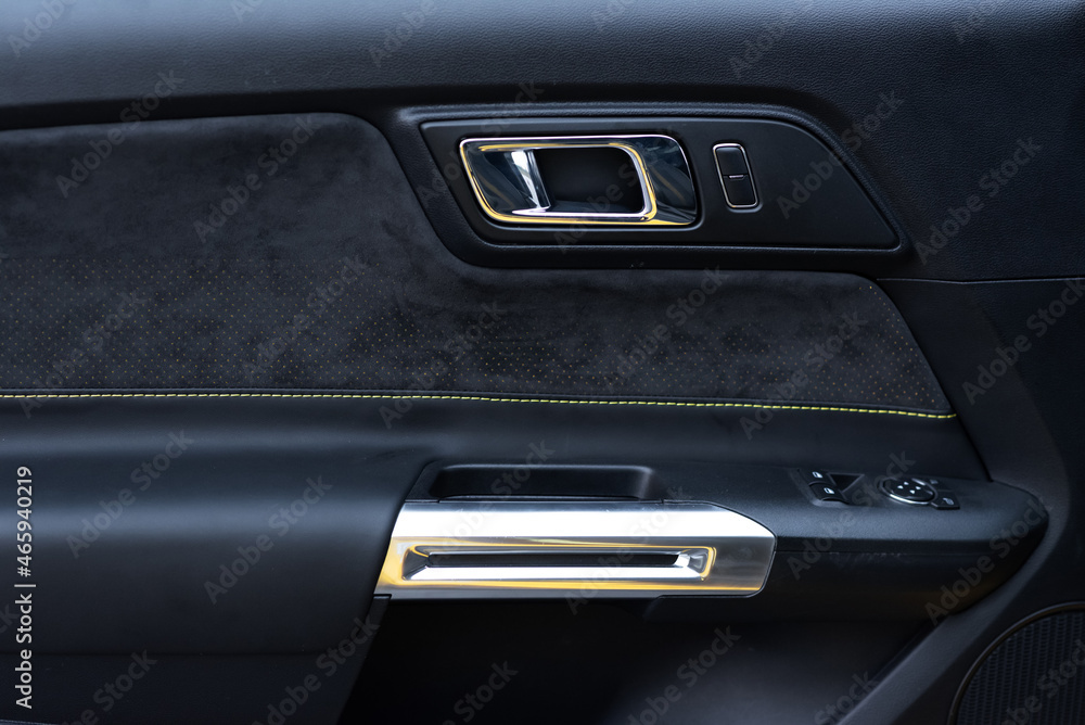 Sports car interior. Close-up Alcantara door trim. Detailing concept Sports car interior. Close-up Alcantara door trim. Detailing concept