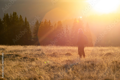 Hiker in magic autumn light