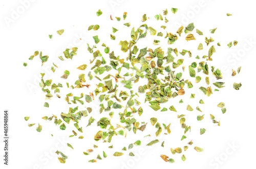 Dried oregano spice isolated on white background. Pile of dry  oregano or marjoram leaves top view. photo