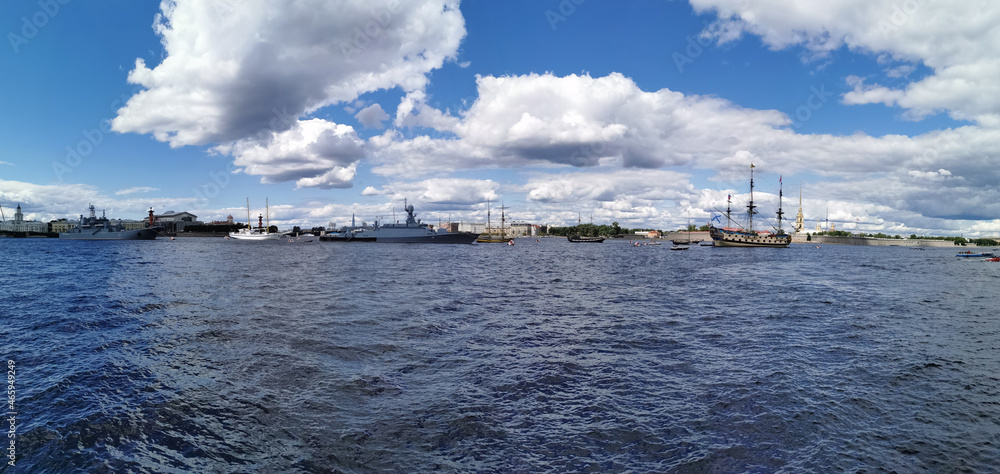 Panoramic view of the warships, frigates and sailboats built in the Neva water area for the Day of the Navy in St. Petersburg.