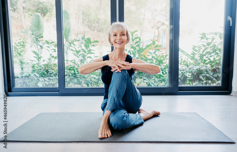 Yoga at home. Senior woman exercising indoor. Concept of healthy lifestyle. Yoga at home. Senior woman exercising indoor. Concept of healthy lifestyle.