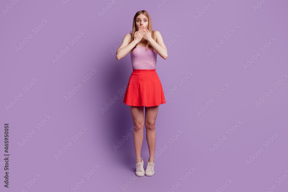 Portrait of crazy voiceless lady crossed hands close mouth wear pink top red short skirt on violet background Portrait of crazy voiceless lady crossed hands close mouth wear pink top red short skirt on violet background