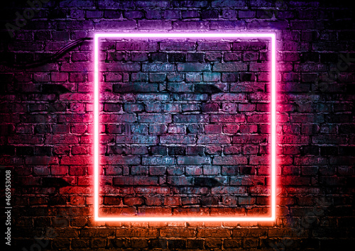Photo Brick wall background with color neon glowing light