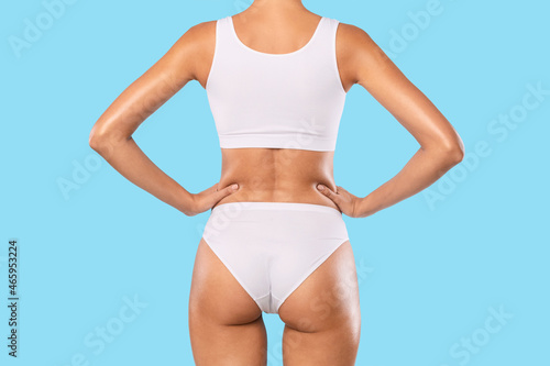 Rear Back View Of Young Slim Woman In White Underwear © Prostock-studio