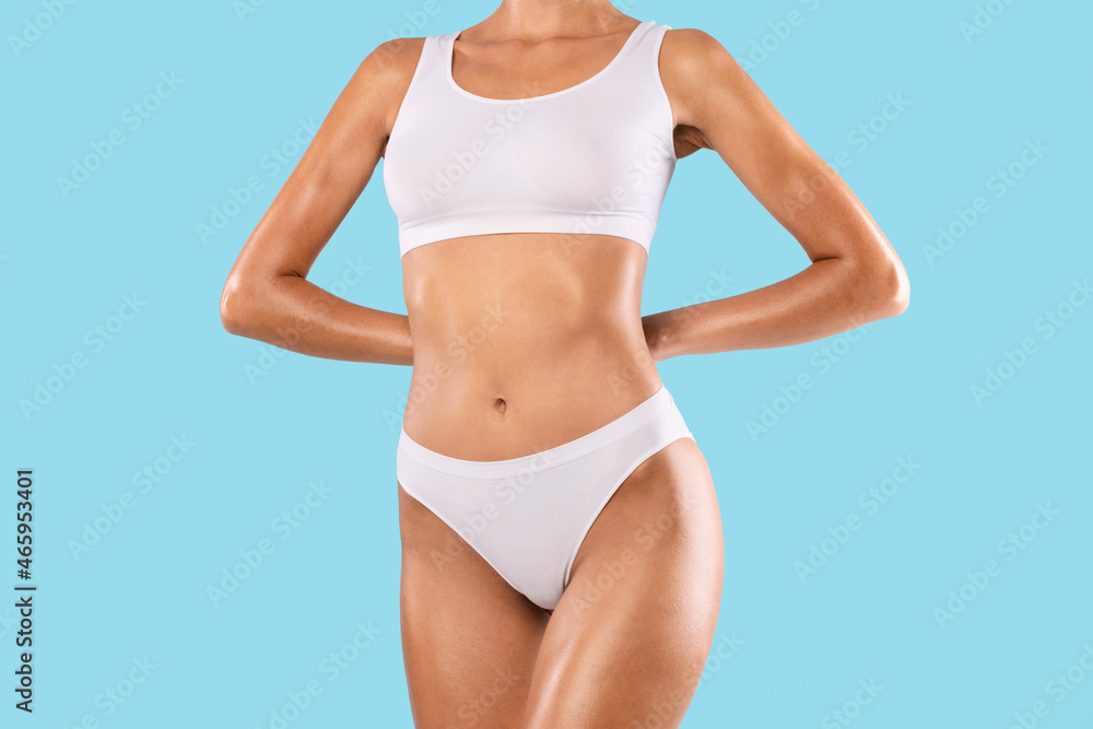 Closeup Of Lady Posing Isolated On Blue Studio Background Closeup Of Lady Posing Isolated On Blue Studio Background