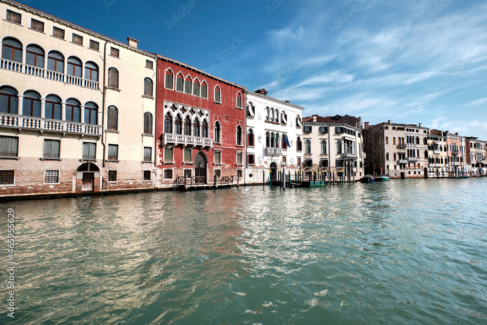 Architecture of Venice, Italy. Historic houses reflects in the water, traditional architecture on Grand Canal in Venice.