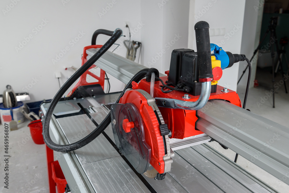 Cutter machine for ceramic tiles. A flat during renovation. Cutter machine for ceramic tiles. A flat during renovation.