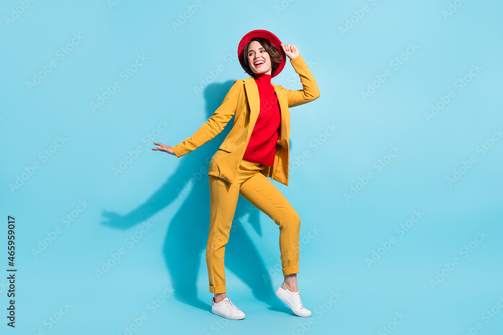 Full length body size view of attractive cheerful girl dancing having fun isolated over bright blue color background Full length body size view of attractive cheerful girl dancing having fun isolated over bright blue color background