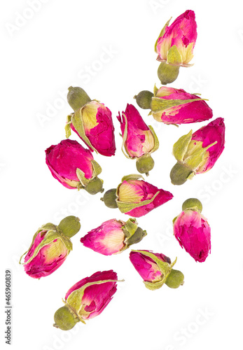 Heap of dry tea roses buds isolated on white background. Rose flower tea. Clipping path. Top view.