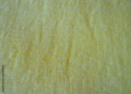 Light yellow natural linen fabric texture for backgrounds. Closeup  