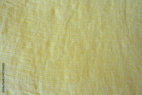 Light yellow natural linen fabric texture for backgrounds. Closeup  