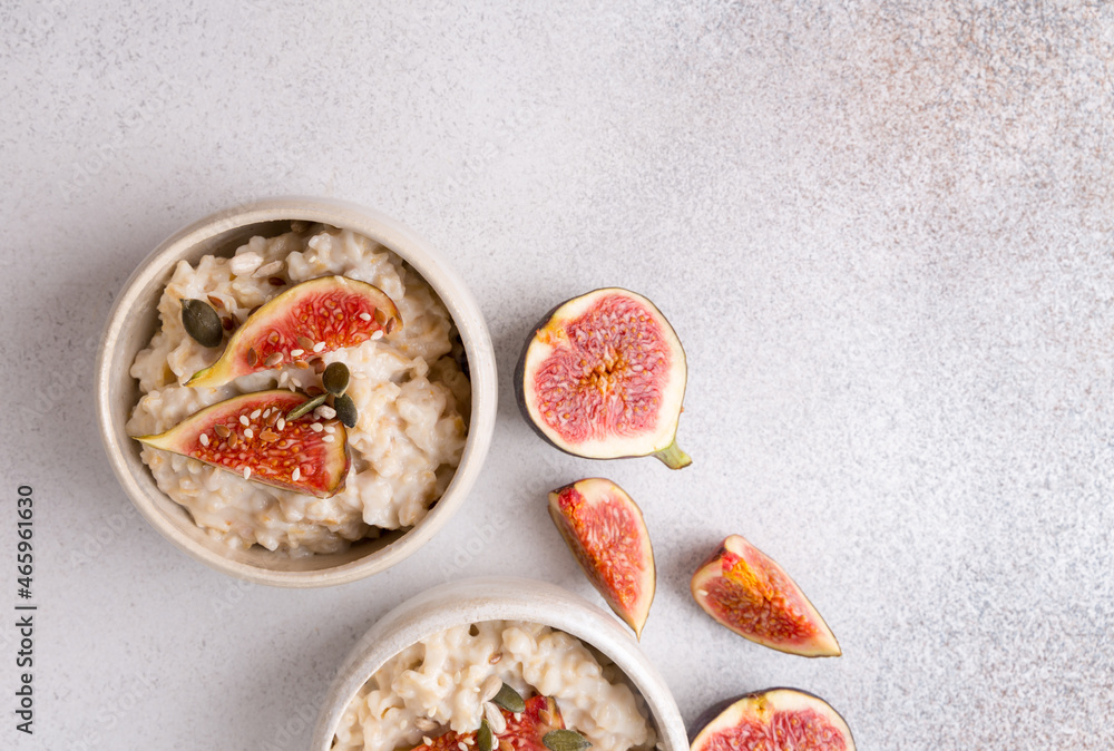 Oatmeal porridge with figs and seeds. Healthy breakfast food. Oatmeal porridge with figs and seeds. Healthy breakfast food.