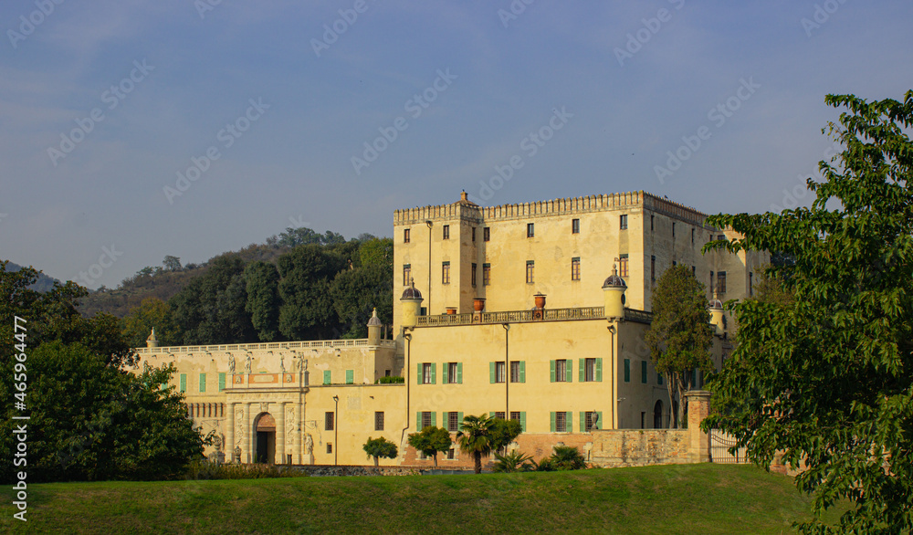 Italian landscape. View of the Catajo castle, a 16th century building surrounded by greenery. Warm afternoon light.