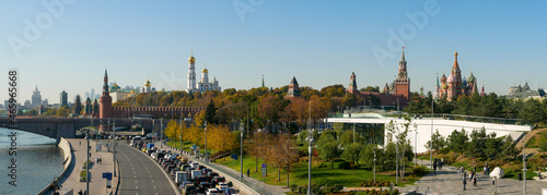 Moscow, Russia - October 5, 2021: Zaryadye park, floating bridge. Panoramic view of the Moskvoretskaya embankment, the Moscow Kremlin and St. Basil's Cathedral on a sunny autumn day