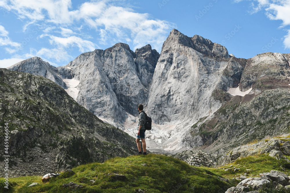 Young backpacker watching the Vignemale north face in french Pyrenees