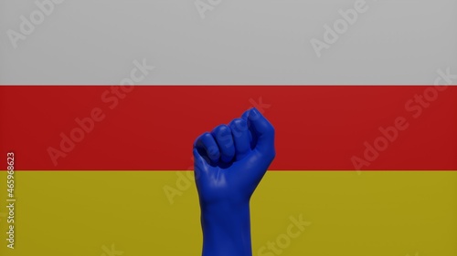 A single raised blue fist in the center in front of the national flag of South Ossetia