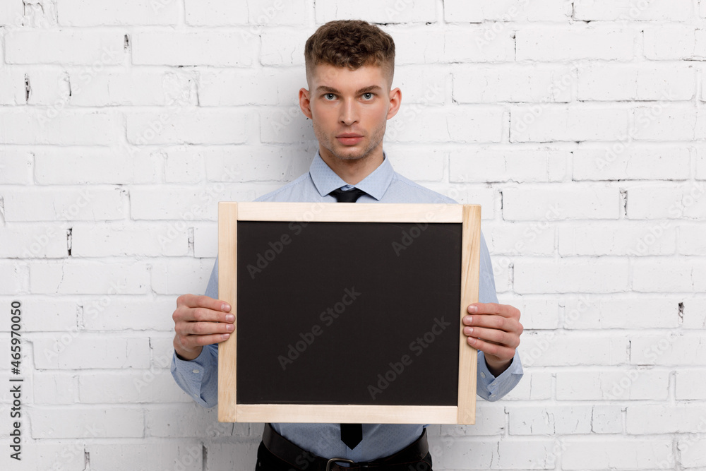 Young businessman is showing the word. Your text here Young businessman is showing the word. Your text here