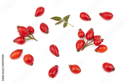 The rosehip isolated on white background. Fresh raw berries with leaves.