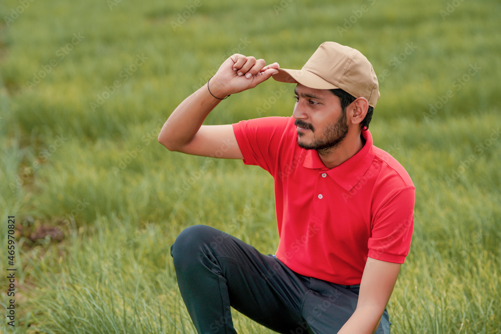 Young indian agronomist or officer at agriculture field. Young indian agronomist or officer at agriculture field.