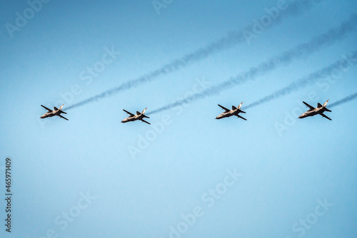 Bild auf Leinwand Military planes are flying in the blue sky