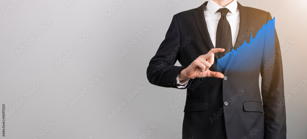 Businessman holding graph growth and increase of chart positive indicators in his business.Investment up concept.analyzing sales data and economic,strategy and planning, Digital marketing and stock Businessman holding graph growth and increase of chart positive indicators in his business.Investment up concept.analyzing sales data and economic,strategy and planning, Digital marketing and stock