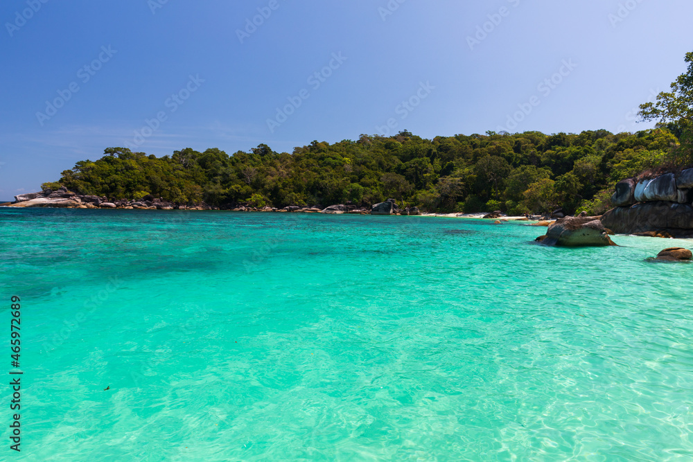 The beautiful and secluded Moken Bay of Boulder Island in Myanmar covering with so many boulders on the beach
