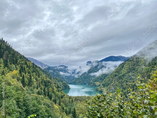 Lake Ritsa in the Caucasus Mountains, in the north-western part of Abkhazia, Georgia, surrounded by mixed mountain forests and subalpine meadows. High quality photo